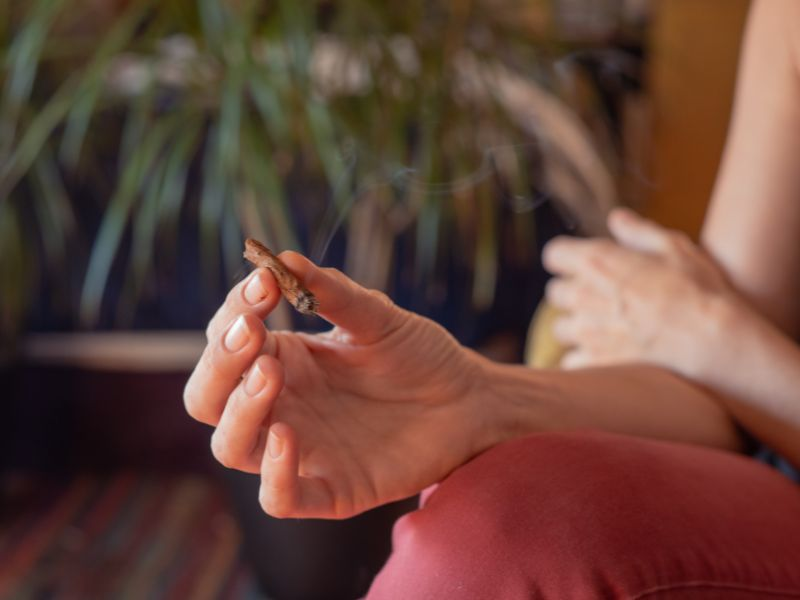 woman holding a blunt