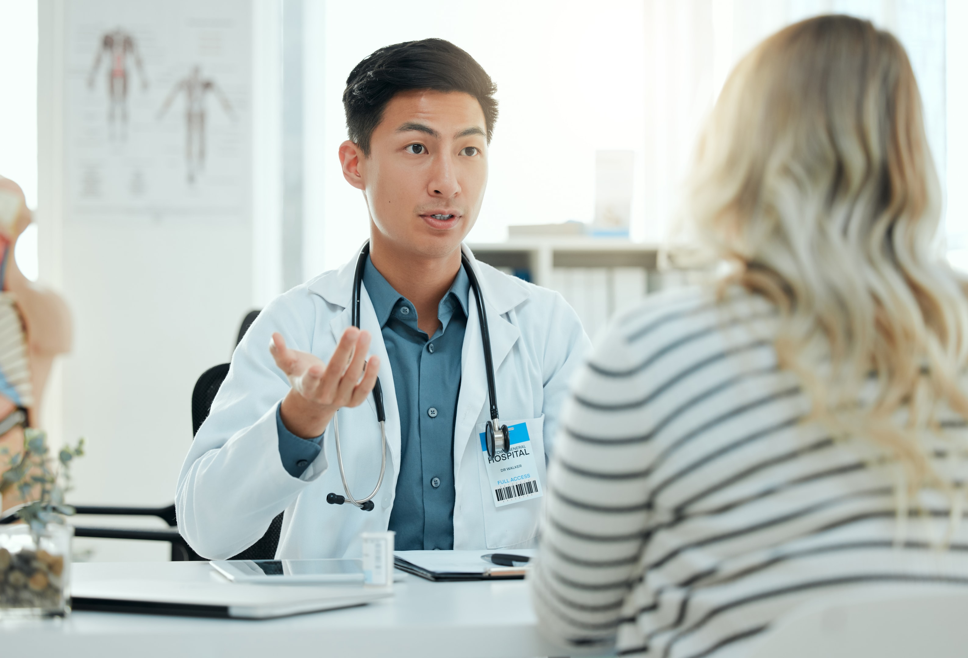 An oral surgeon describing the after-wisdom tooth removal care procedures
