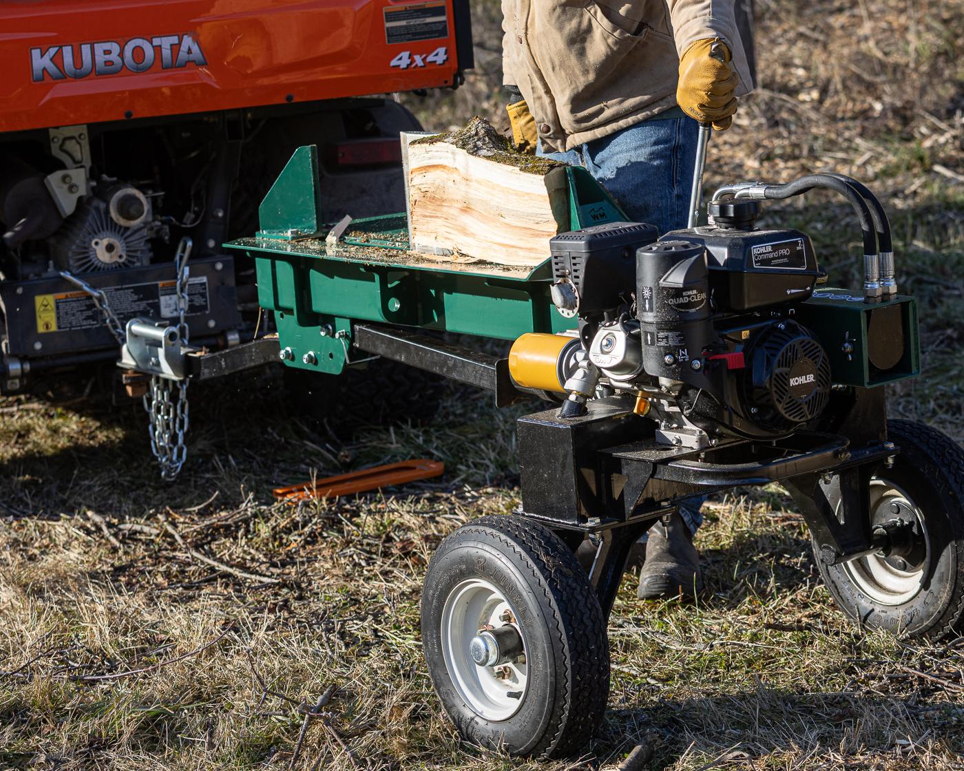 A Woodland Mills LS218 Log Splitter splitting a round.