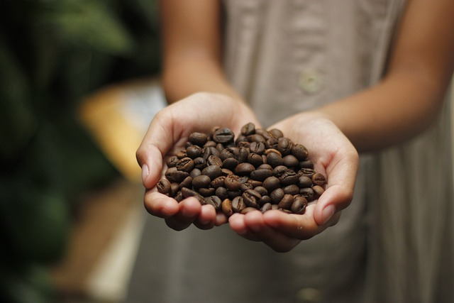 Coffe beans in hands