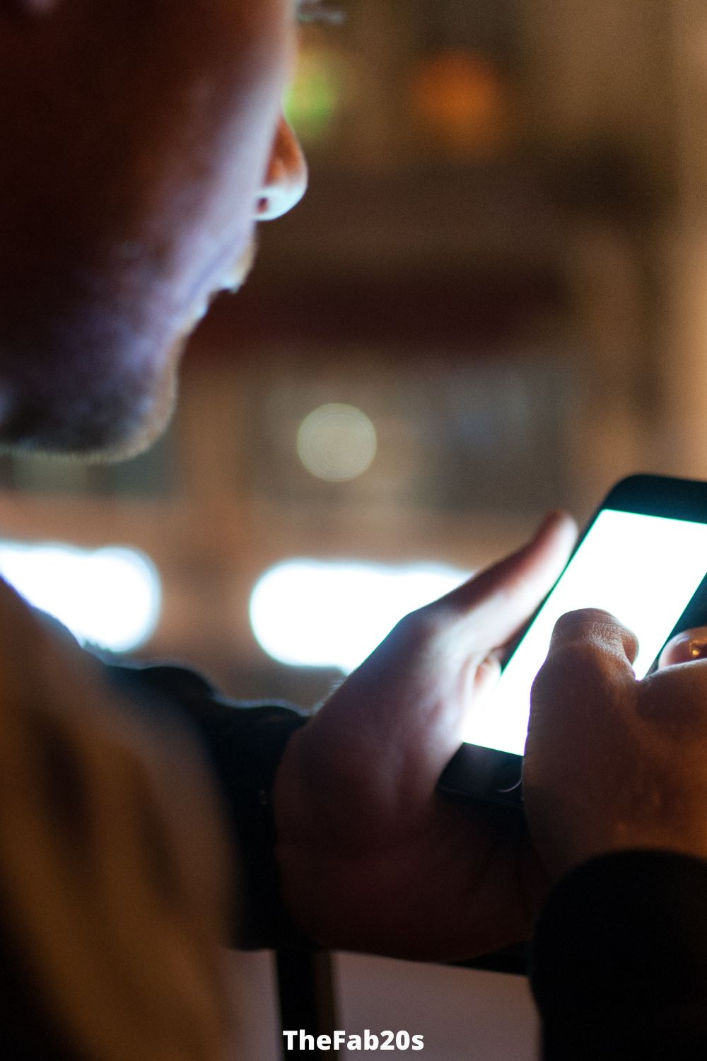 Man chekcing his phone - What does it mean when a guy blocks you?