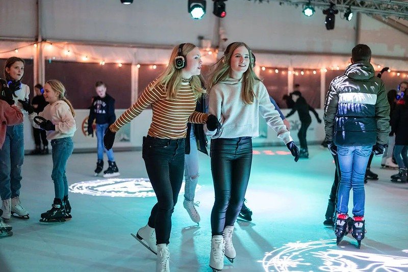 Two ice skating during silent party