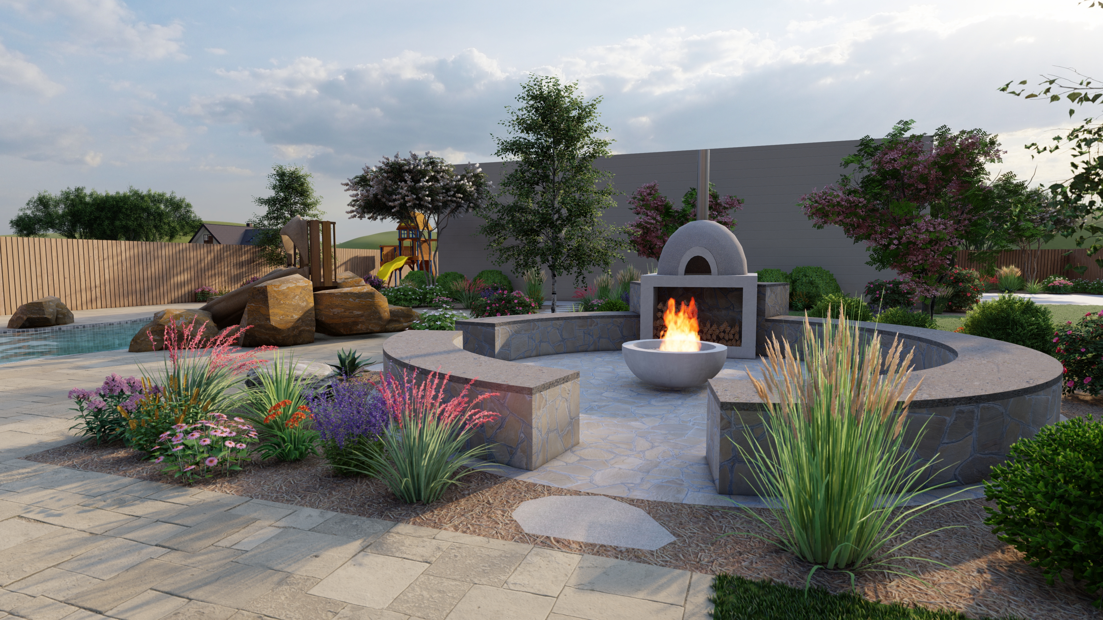 A natural rock garden behind a fire pit area lined with pea gravel and pavers
