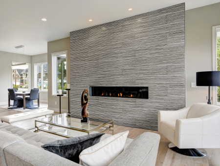 Contemporary fireplace boasts sculptural tile in modern living room