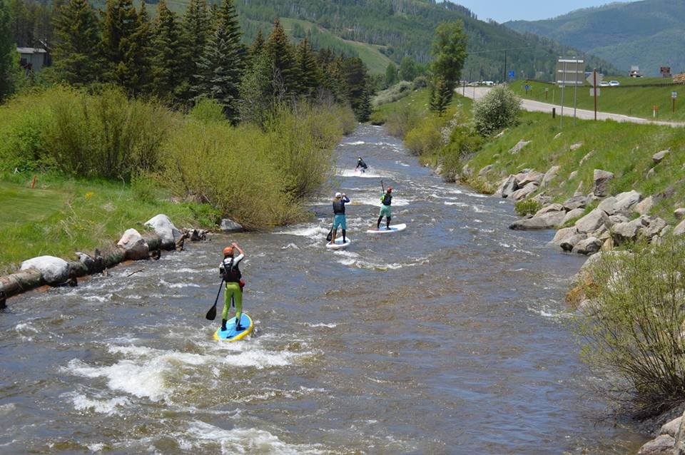 paddle boards on the river