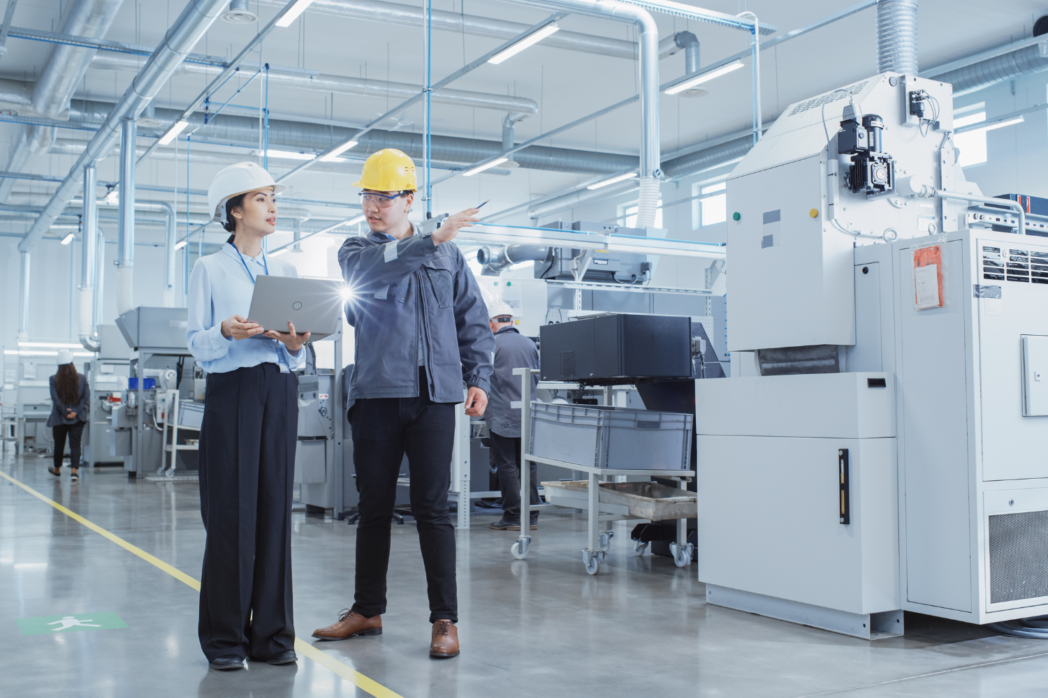 Business owner checking a manufacturing facility.