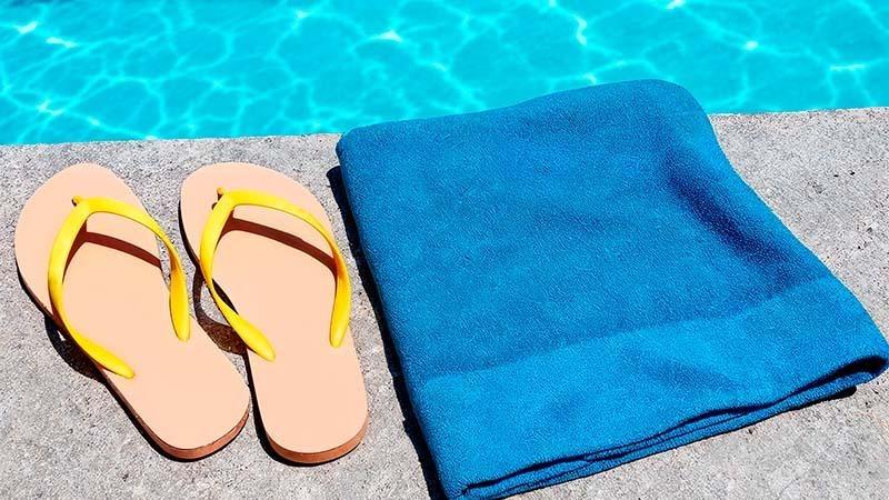 Microfiber Blue beach towel near a pool