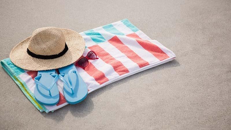 Folded beach towel in the sand
