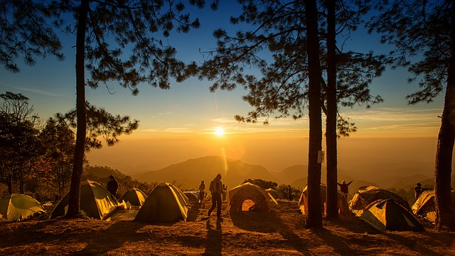 Campers in tents at sunset