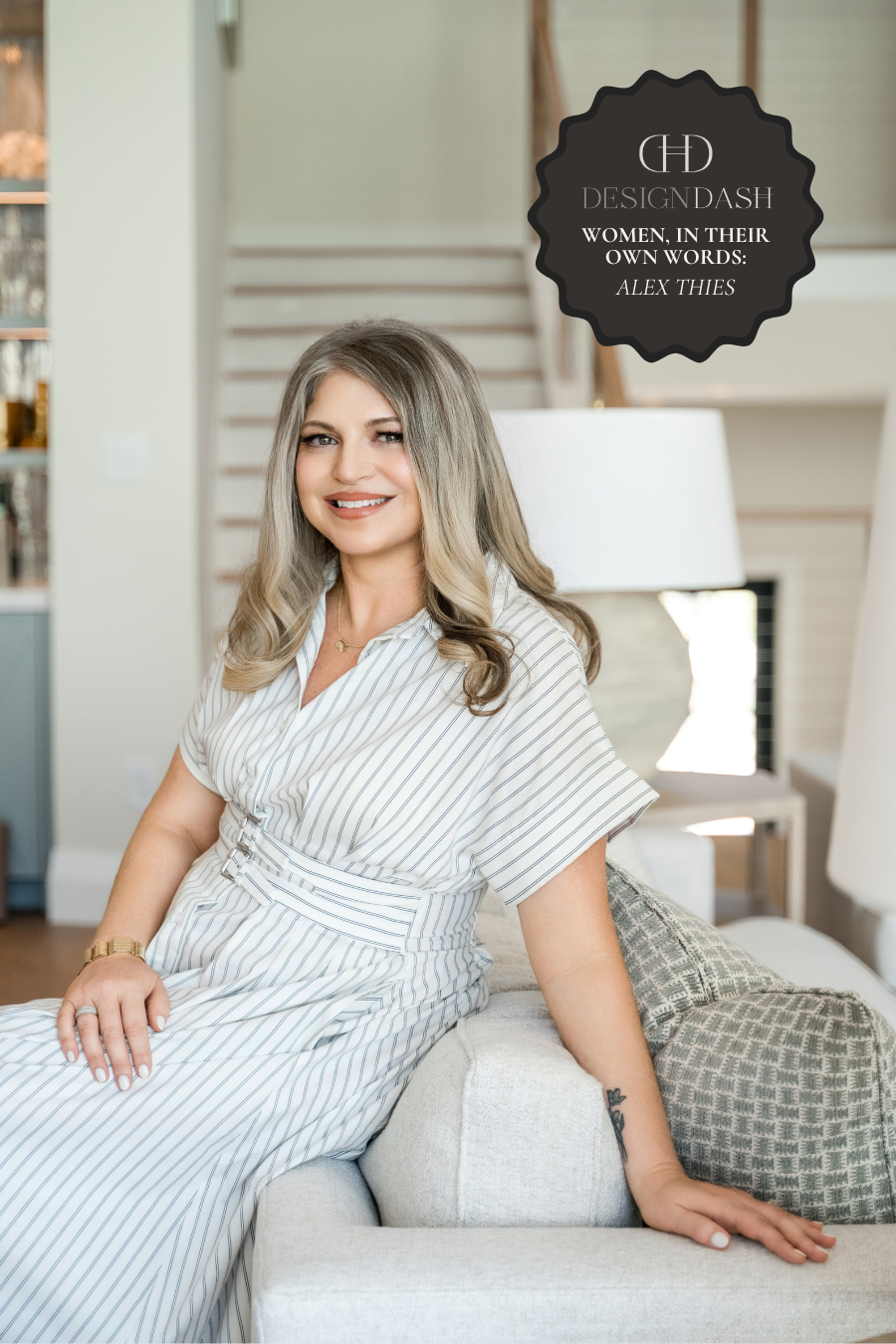 a portrait of Alex Thies sitting on a sofa in a formal living room