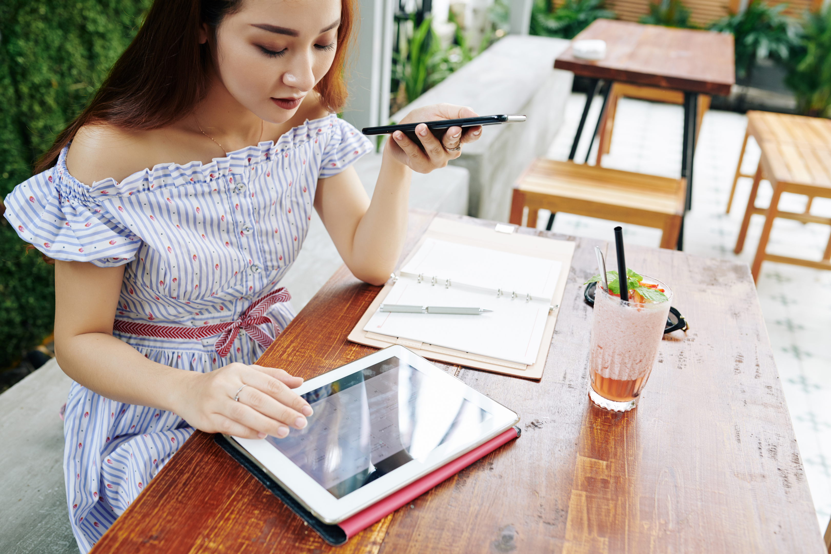 Woman checking calendar app on tablet