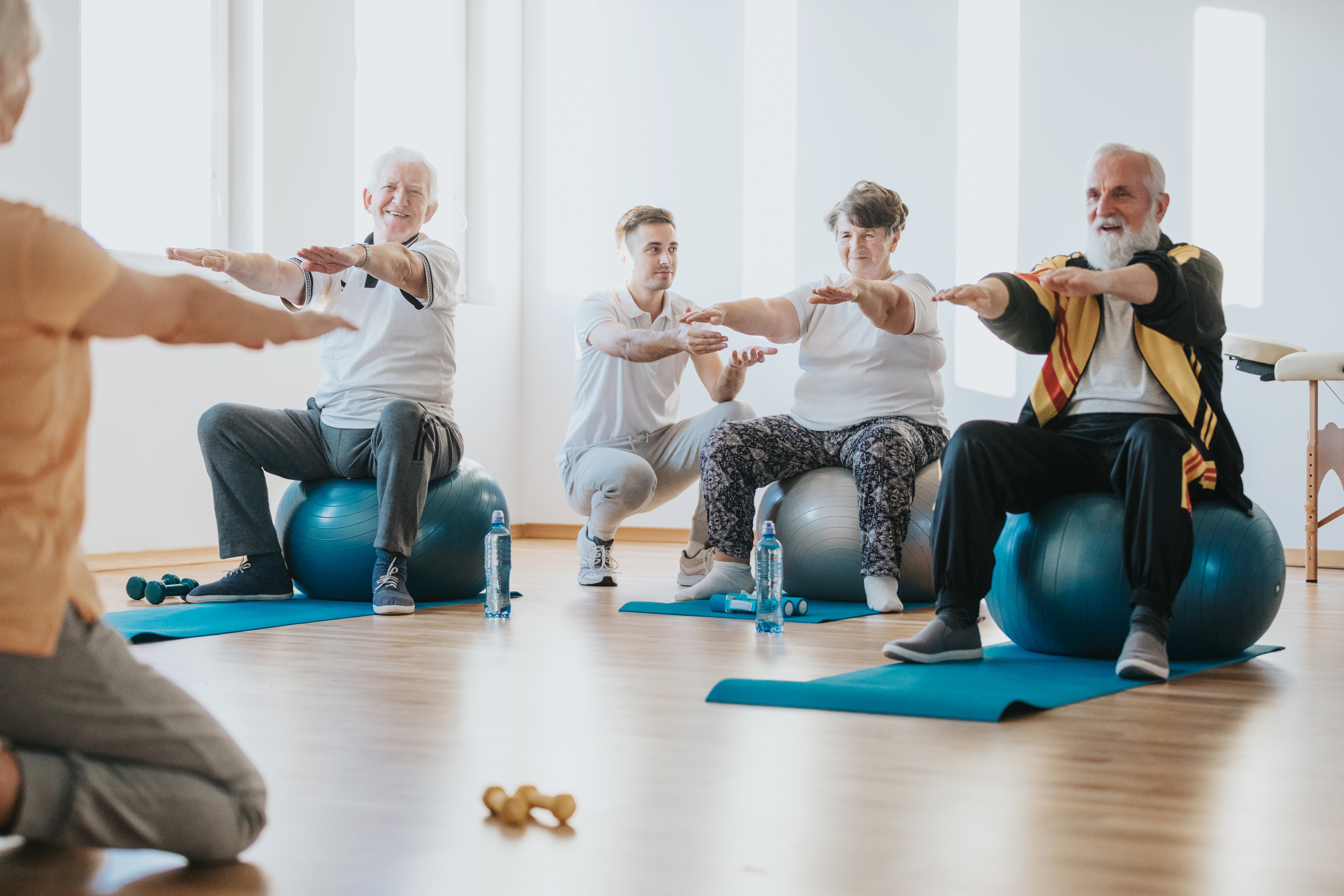 Image of seniors participating in gentle exercises to relieve hip bursitis pain.