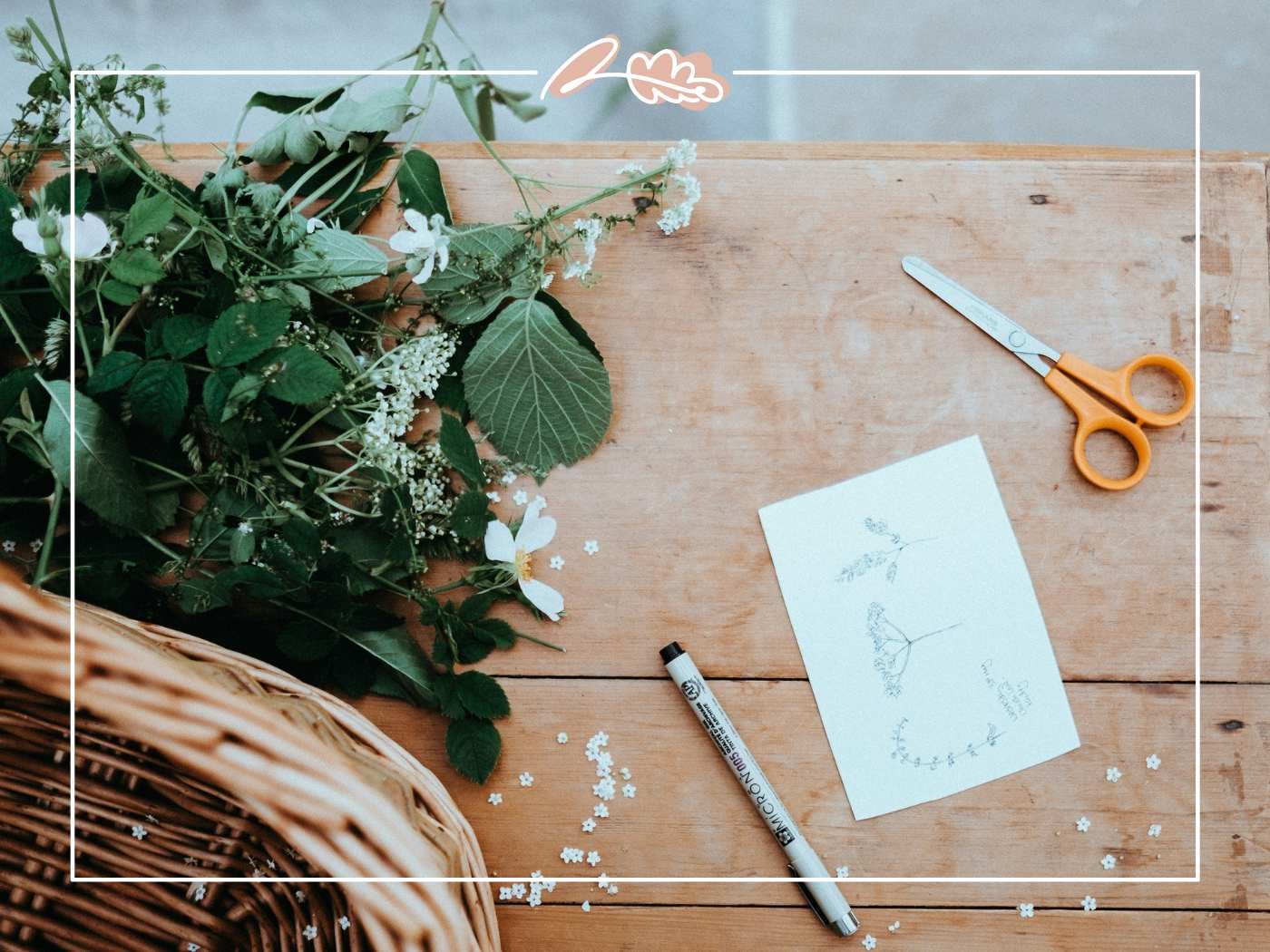 Greenery and crafting supplies on a wooden table. Experience on our website.