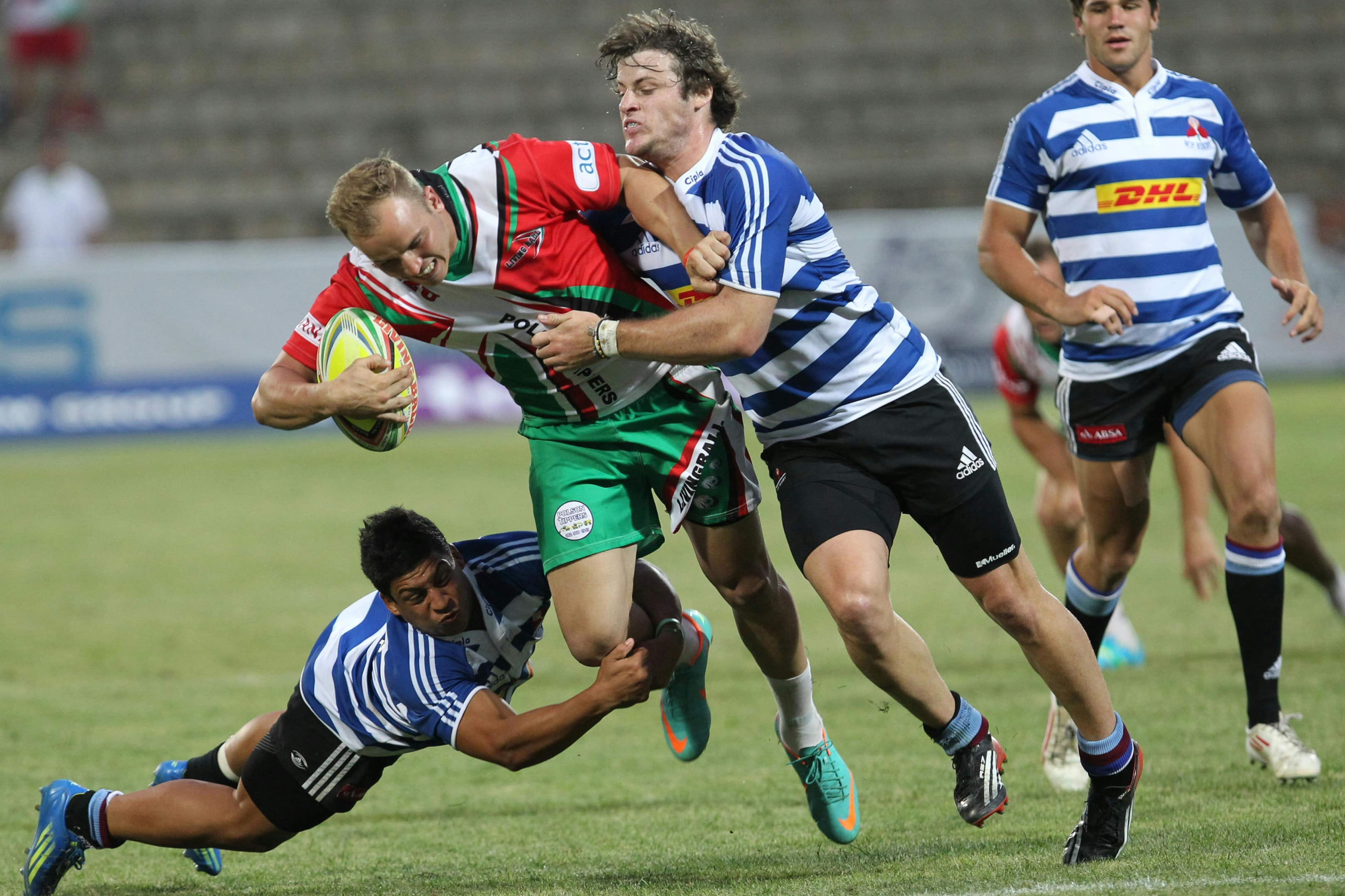 Photo by Patrick Case: https://www.pexels.com/photo/man-in-blue-and-white-striped-soccer-jersey-playing-rugby-3641367/