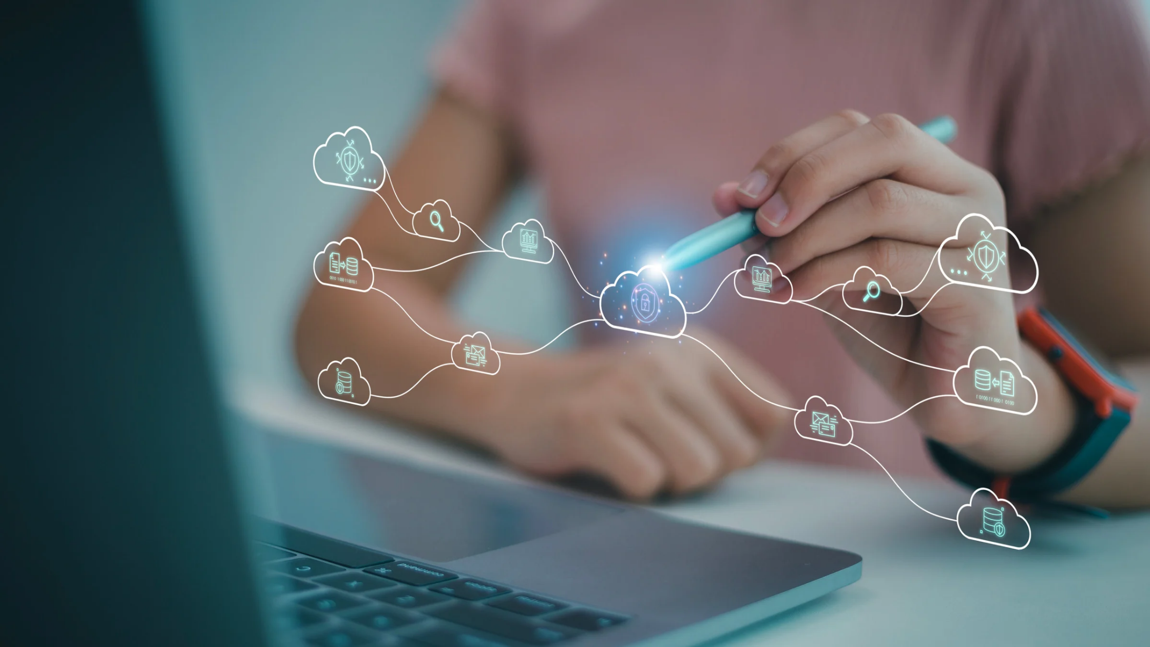 Person interacting with a stylus and holographic cloud network, representing digital cloud-based solutions and connectivity.