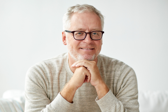 man in need of oral and maxillofacial surgeons to place bone graft before dental implant placement 
