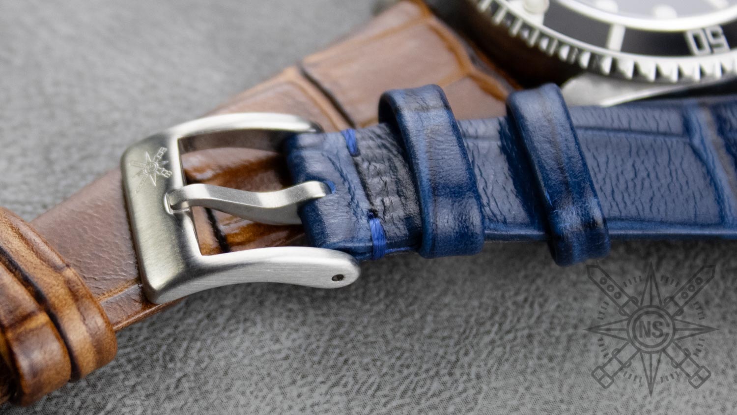 A stylish timepiece enhanced with a blue alligator strap.