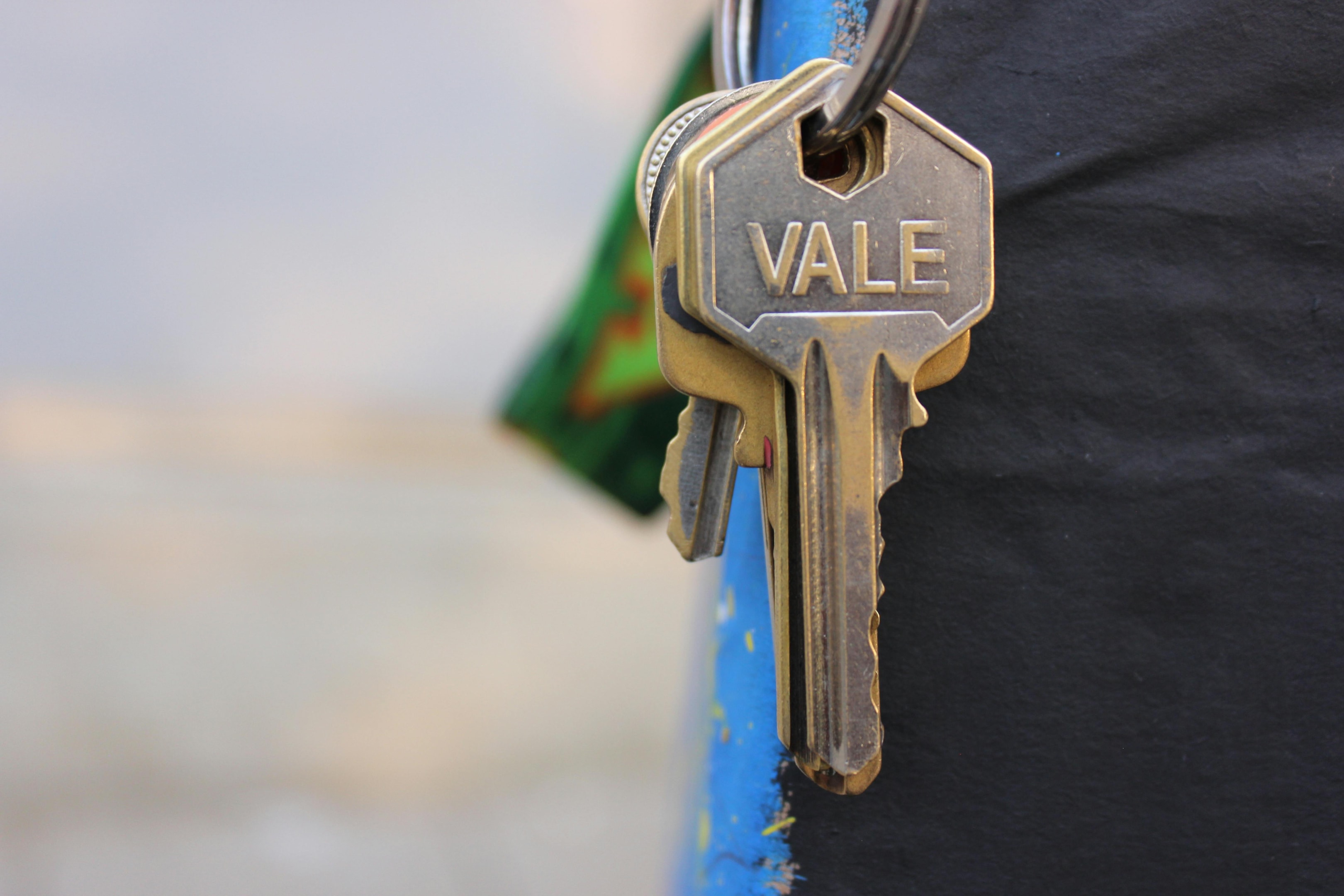 Real estate investor holds keys to mobile home investment property.