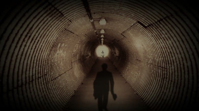 A shadowy figure in a tunnel, representing the idea of a villain.