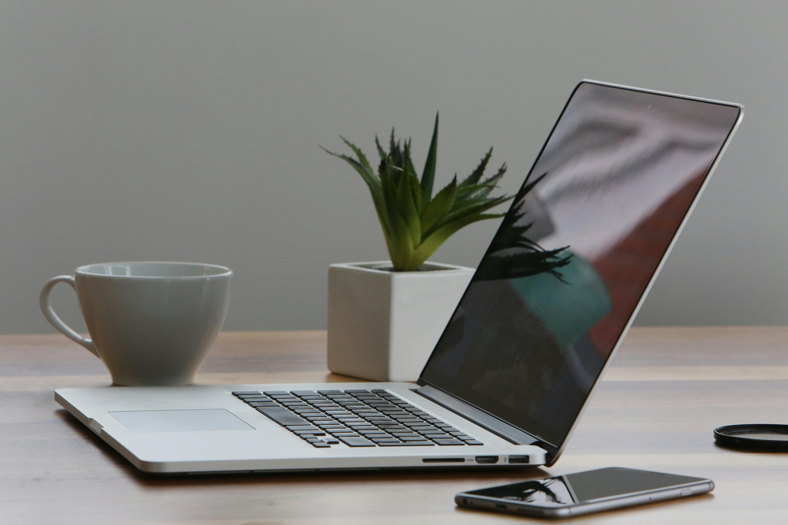 Laptop used by real estate investor to boost marketing tactics. 