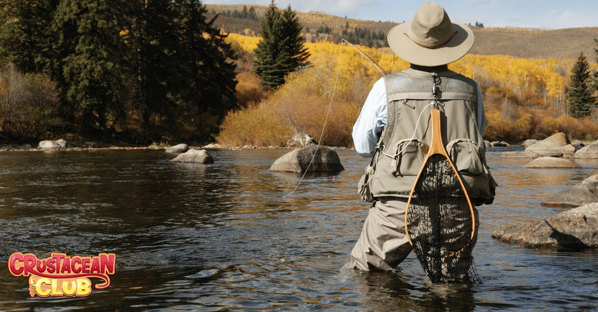 Seasonal fishing activities for all ages - a man pictured fly fishing during the Fall