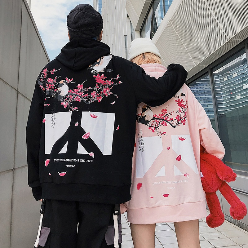 A group of people wearing streetwear clothing on the street