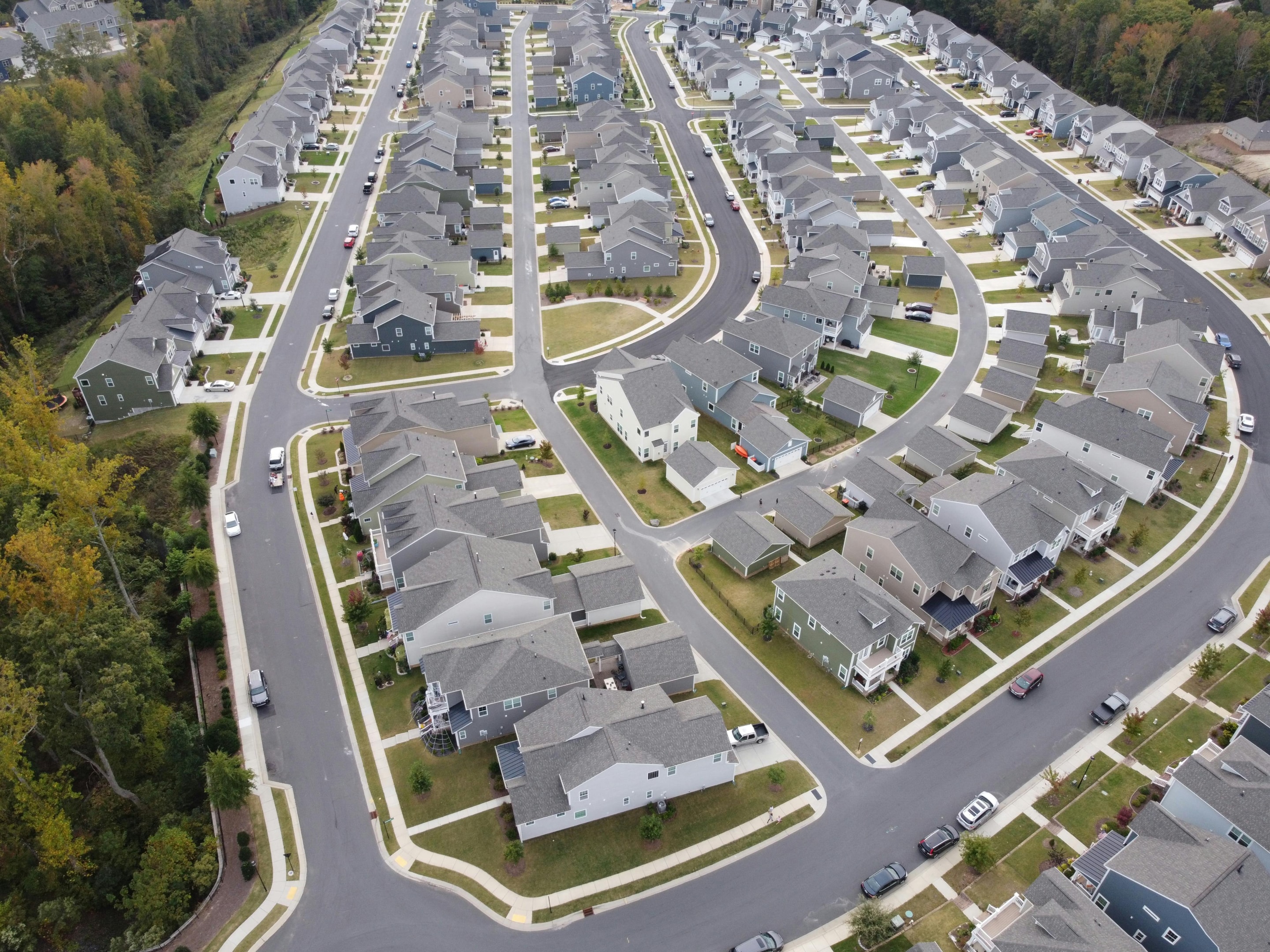 Aerial view of neighborhood with many single family homes. 