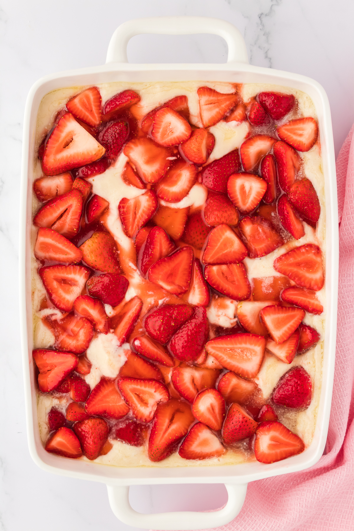 strawberry mixture on top of strawberry cobbler topping