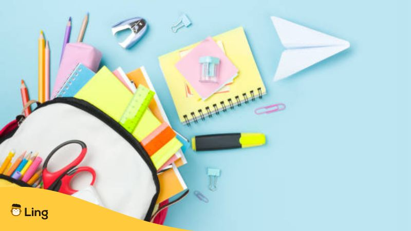 Many colorful school supplies and backpack  - Mongolian school phrases