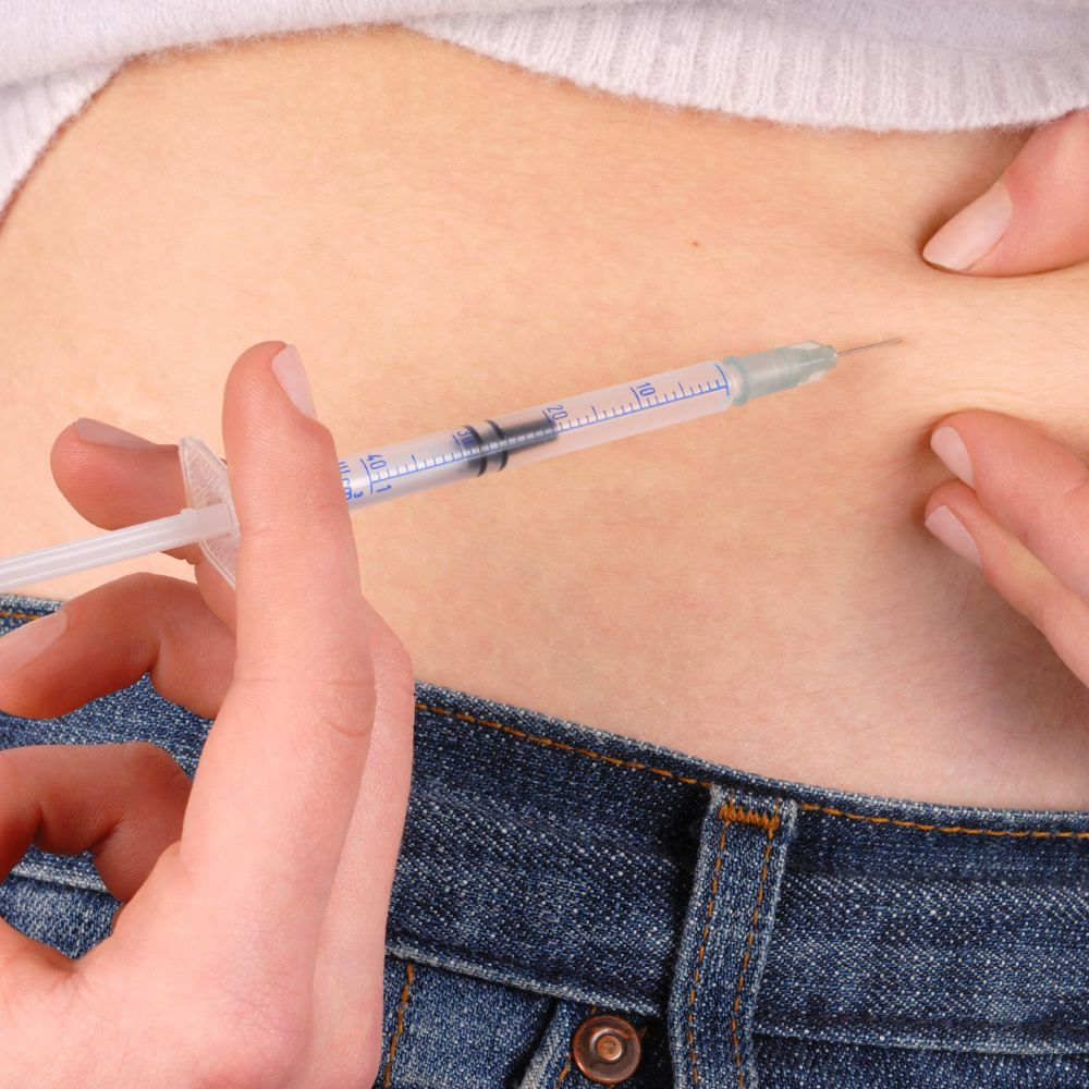 A person taking semaglutide injections to reduce appetite and lower blood sugar