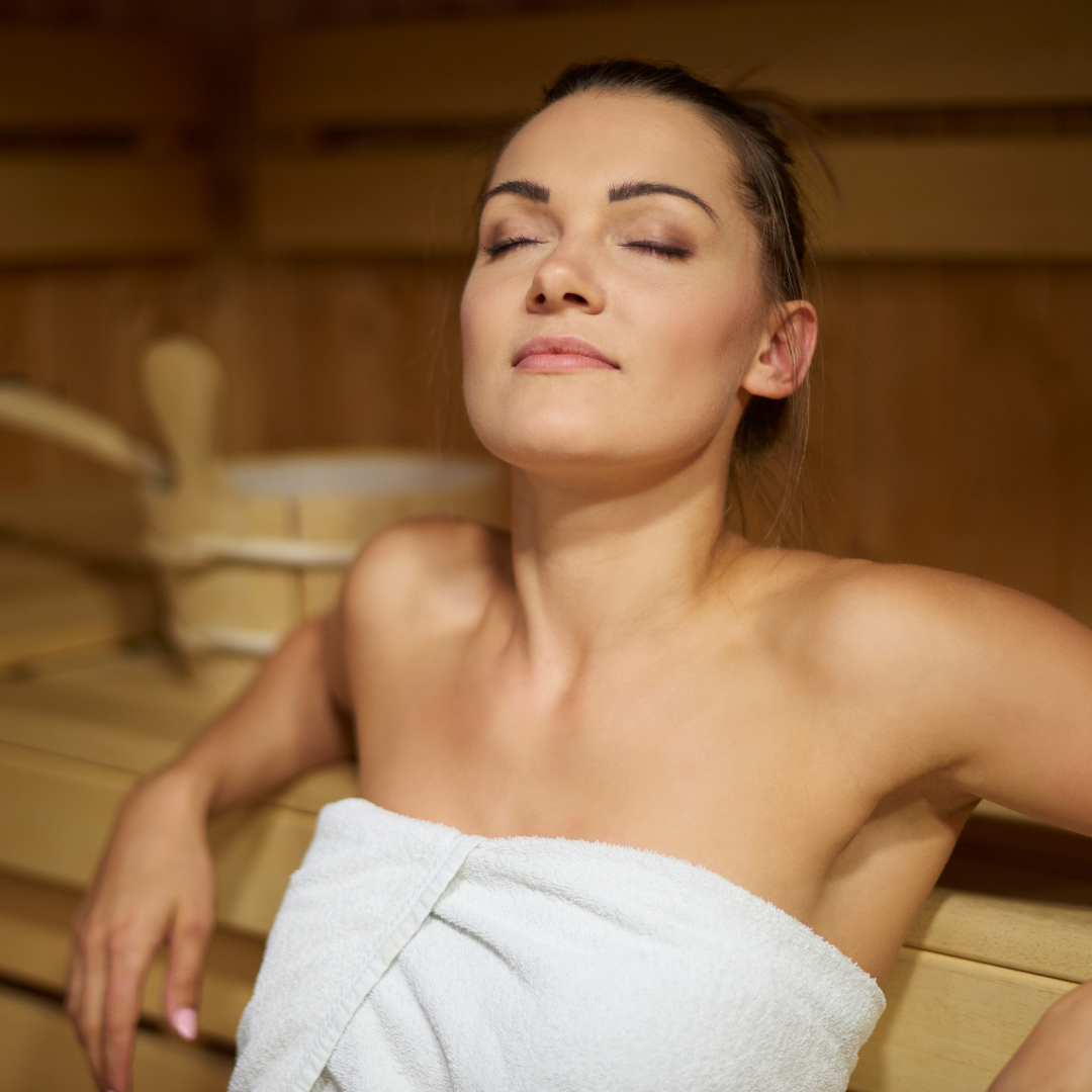 Image of a woman with her stressed relieved from the sauna.