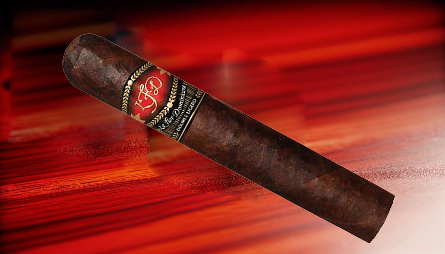 A dark and richly flavored Double Ligero Maduro cigar resting on a wooden surface