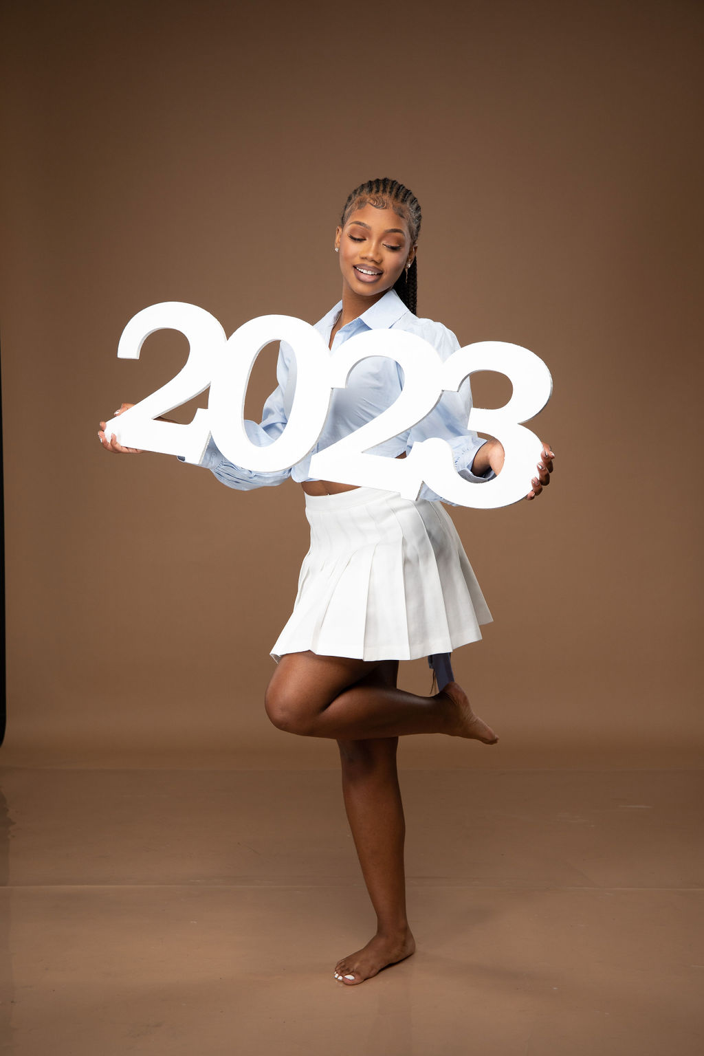 Picture ideas for girls include our giant 2023 photo prop.
