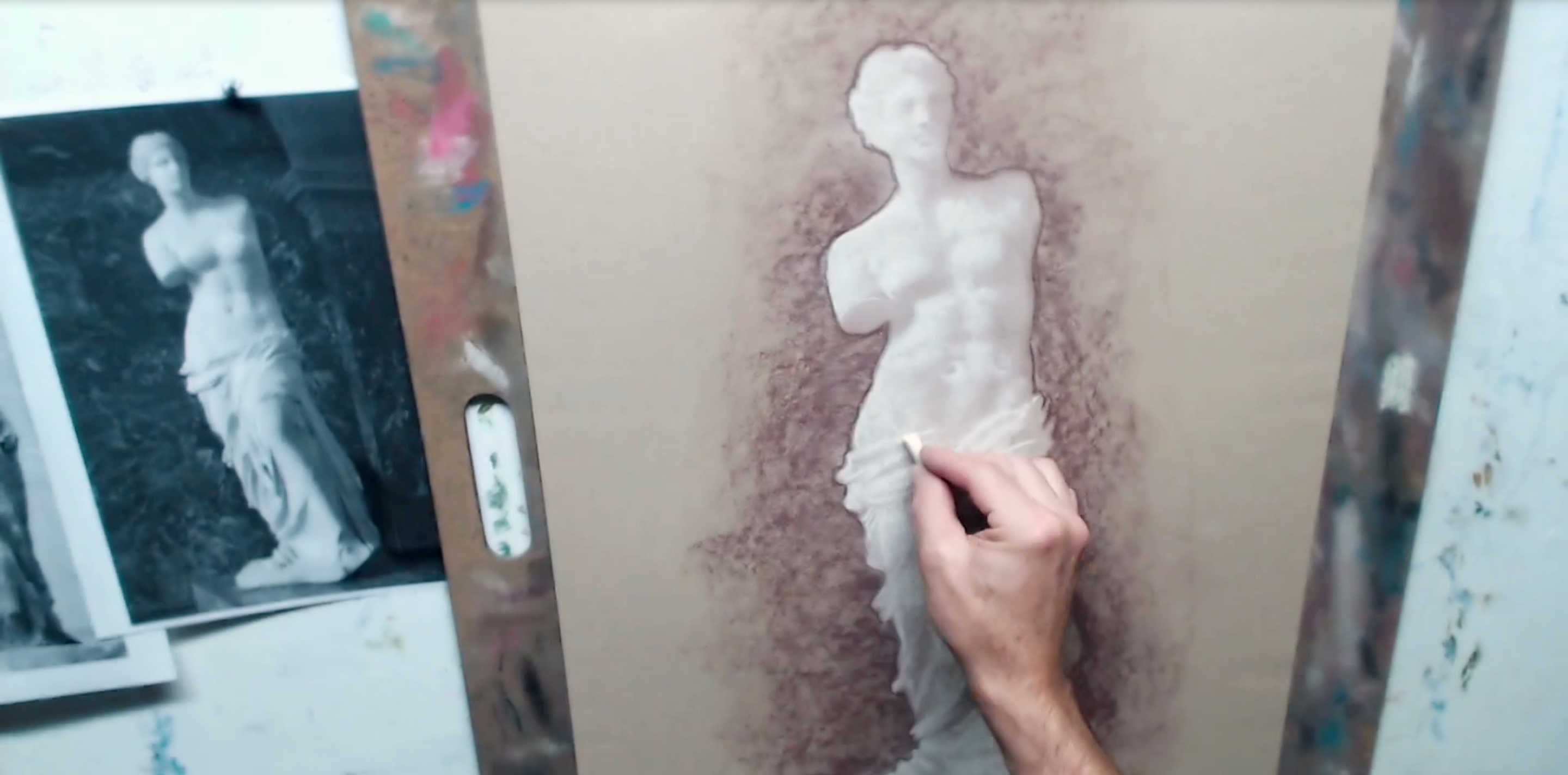 A person drawing a figure, focusing on the fundamentals of figure drawing, applying the various elements of the human body