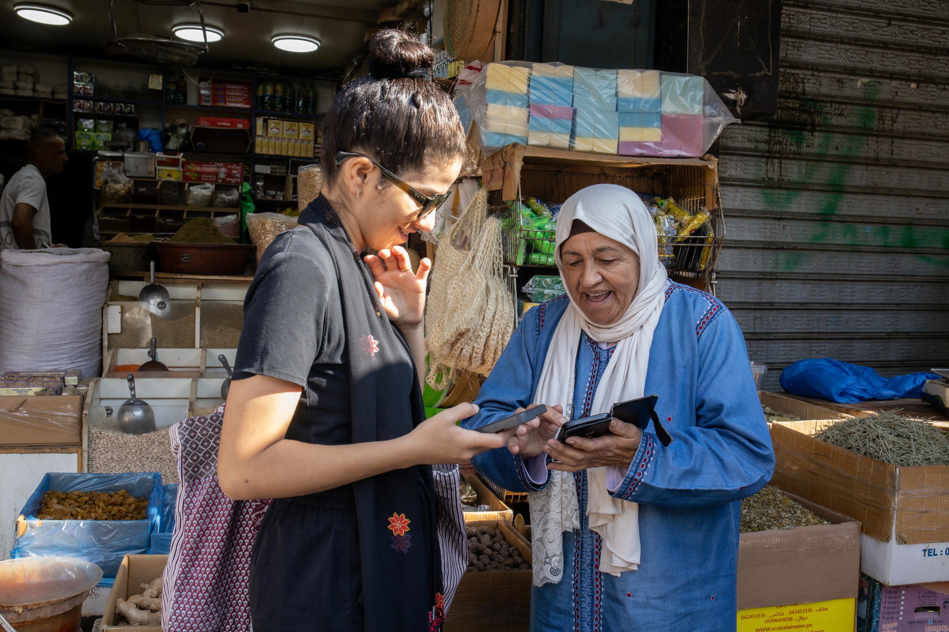 Jinan buying her groceries in Ramallah market