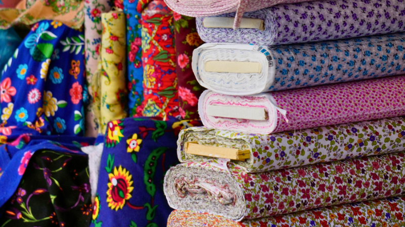 Many colorful modal fabrics are stacked on top of each other