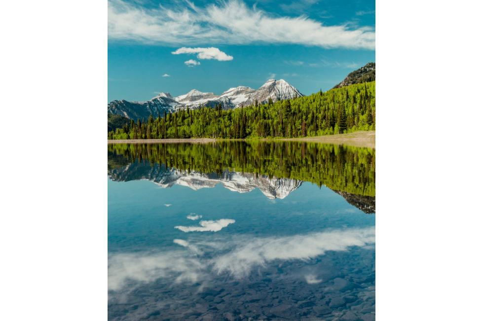 A glassy flat body of water will help a beginner stand up paddle or practice sup yoga.
