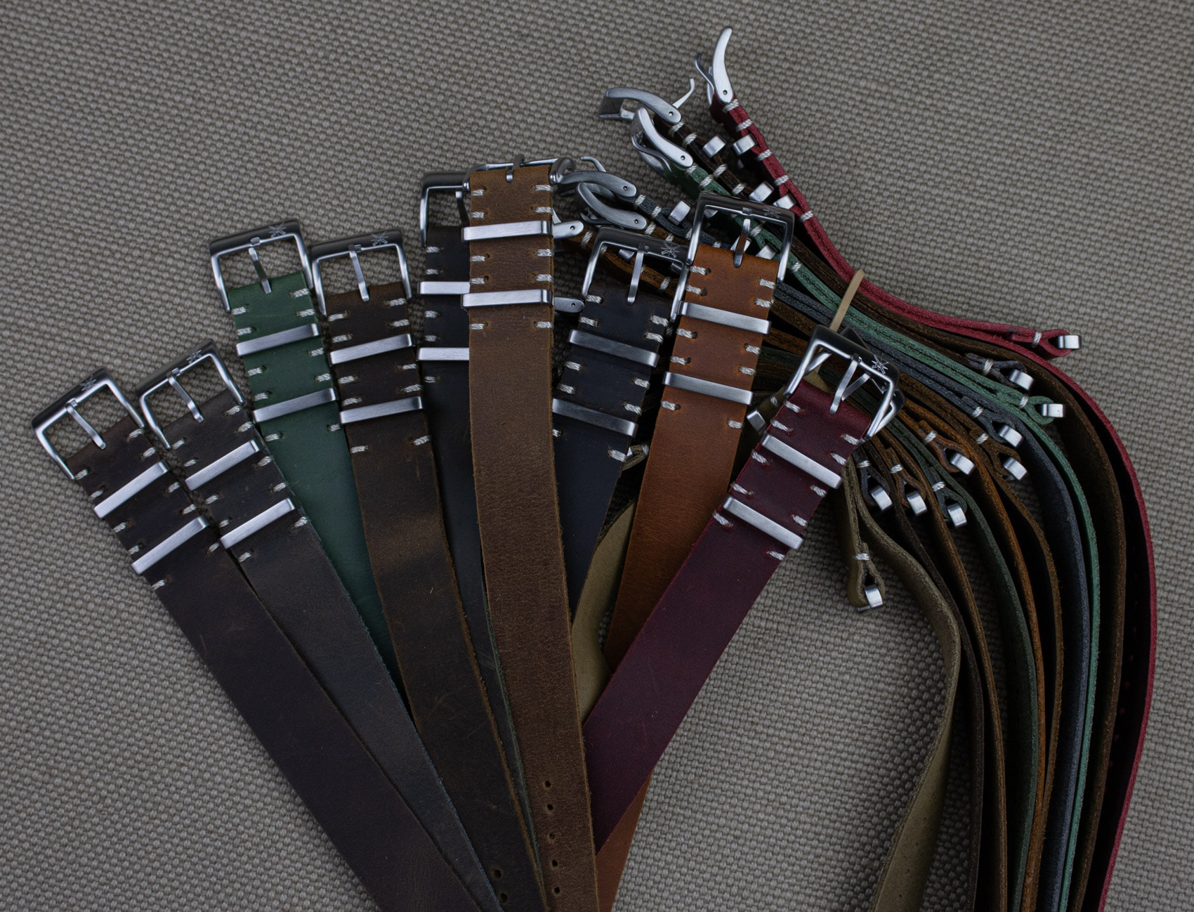 Textured natural leather watch straps in red displayed together.
