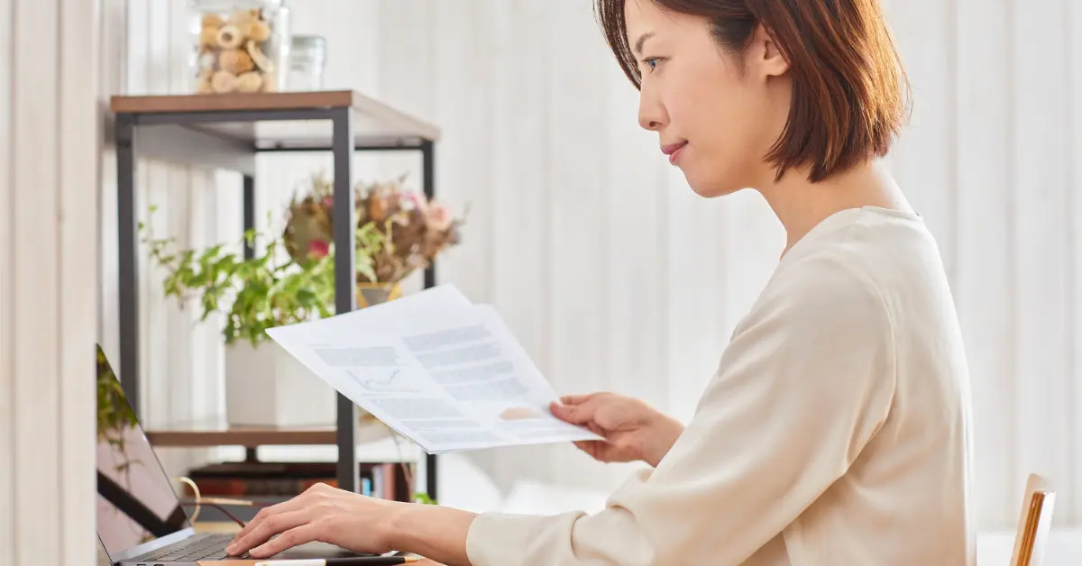 Businesswoman reviewing a sample operating agreement for LLC to secure compliance and business structure.