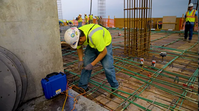 A technician using a wireless concrete sensor