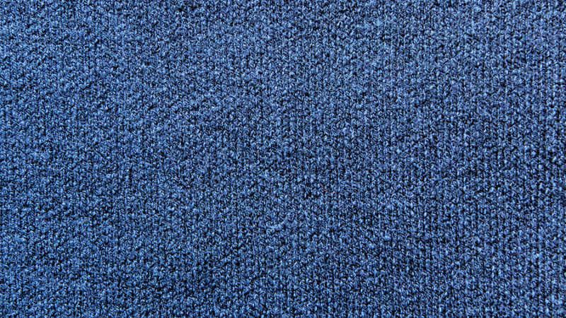 A close-up shot of a dark blue cotton fabric