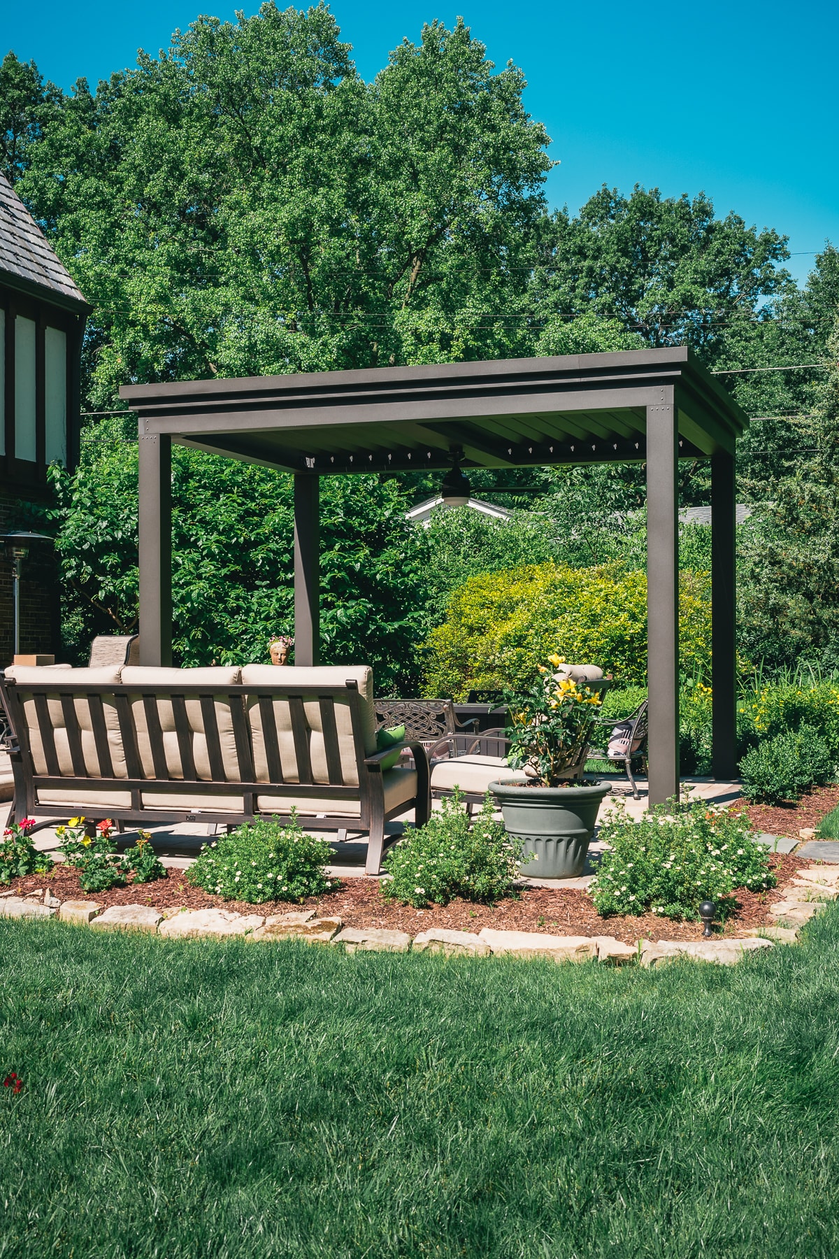 vibrant color pergola ideas are easy to consider with a fire pit, seating area, or outdoor dining area. Consider adding nice potted plants or climbing vines to enhance the curb appeal.