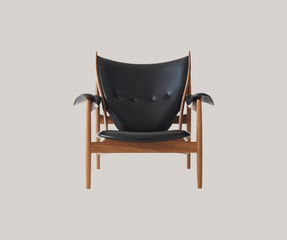 Finn Juhl furniture includes the Chieftain Chair pictured above, with oak wood and the same aesthetics