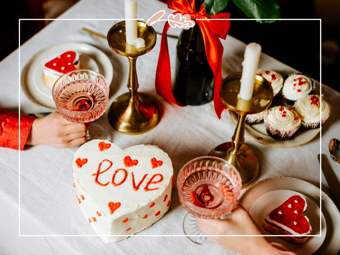 A romantic table setting with heart-shaped cakes, candles, and glasses of rosé, perfect for a celebration of love - Fabulous Flowers and Gifts.