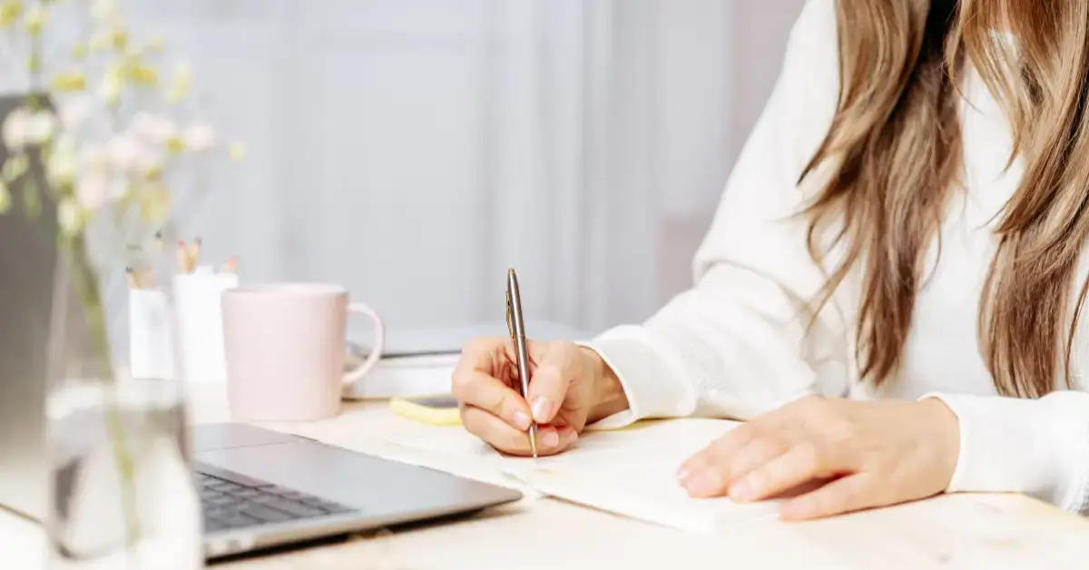 Woman reviewing EFTPS enrollment setup and quarterly tax payments for OnlyFans creator taxes.