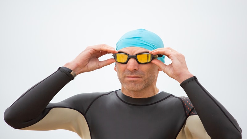 A stylish and professional swimmer wearing a cap