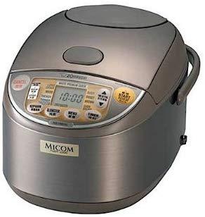 The image shows a top view of the Zojirushi NP-HCC18 induction heating rice cooker, a large family model designed to prepare up to 10 cups of perfectly cooked rice, including options for brown rice and sushi rice. The stainless steel inner cooking pan is visible, showcasing its sleek design and functionality as a dedicated rice cooker.