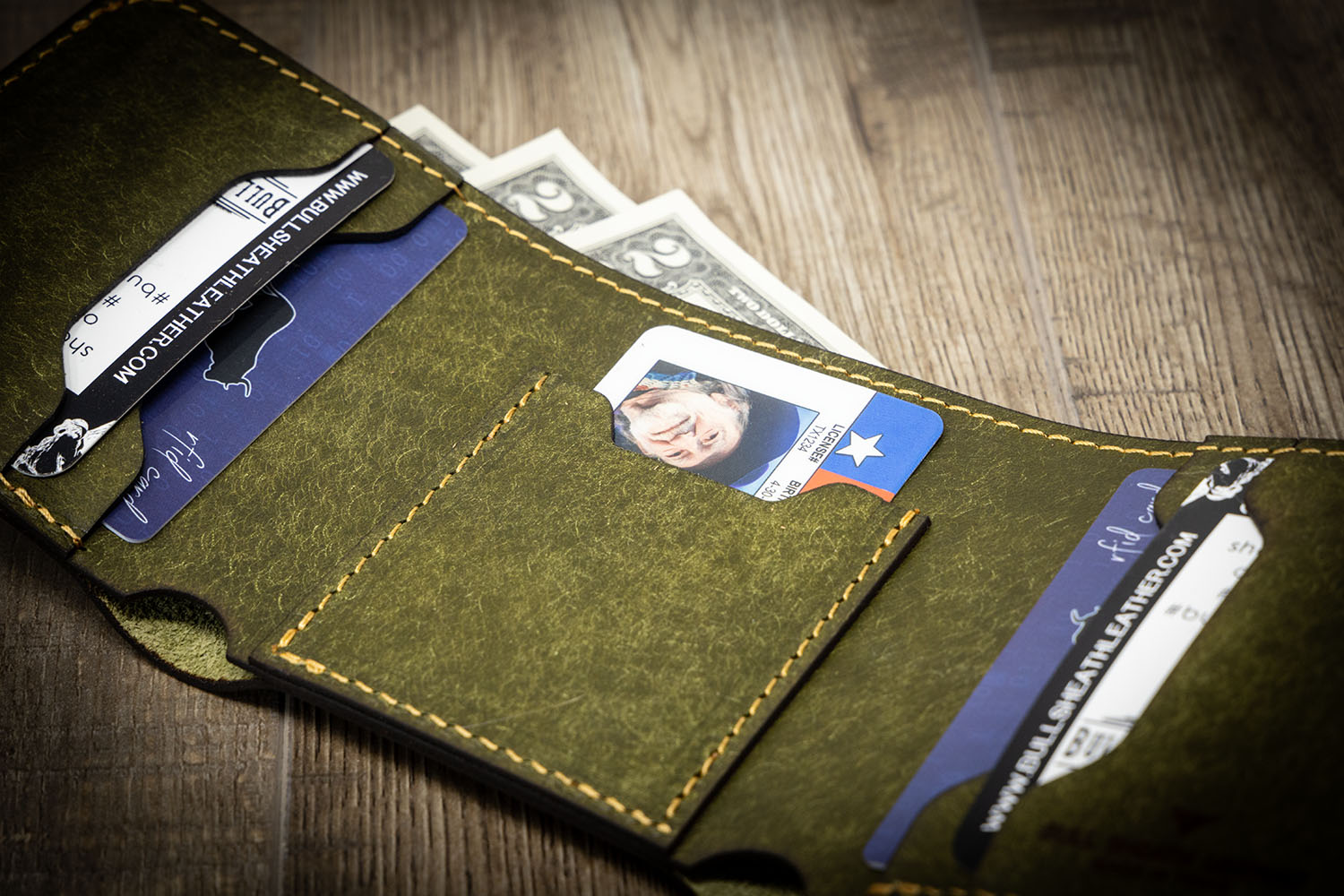 A picture of a trifold ID wallet showcasing its multiple compartments, clear ID window, and compact size - all essential features for everyday use.