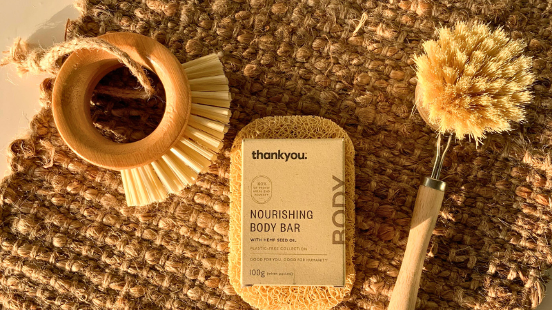 Soap and brush sitting on top of a jute mat