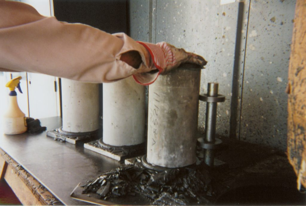 A close-up image of a capping compound being applied to a concrete surface as an alternative capping material.